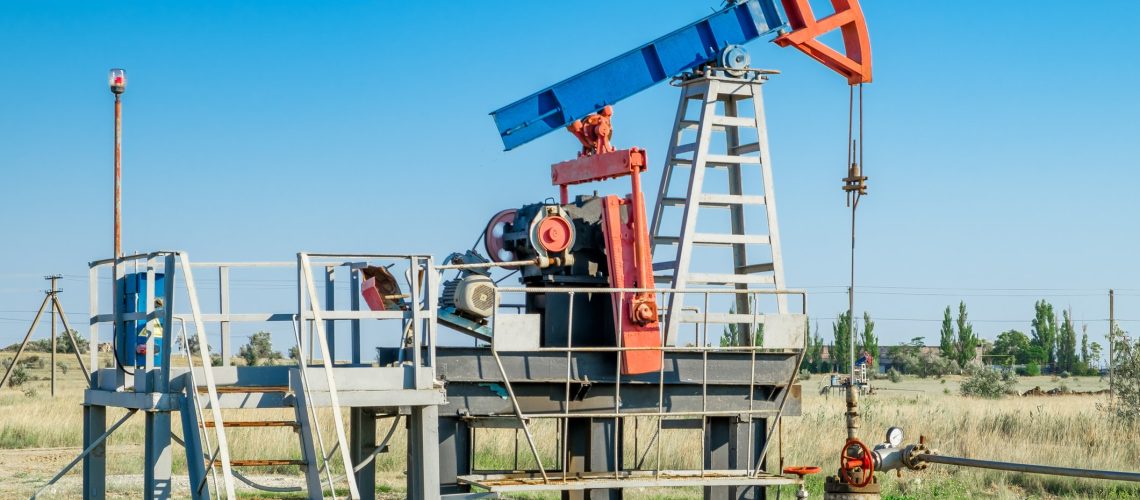 Oil pump in the field, on clear day